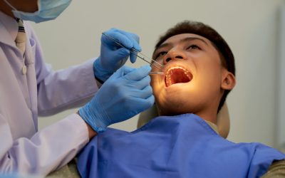 Young patient visiting dentist to have annual teeth examination